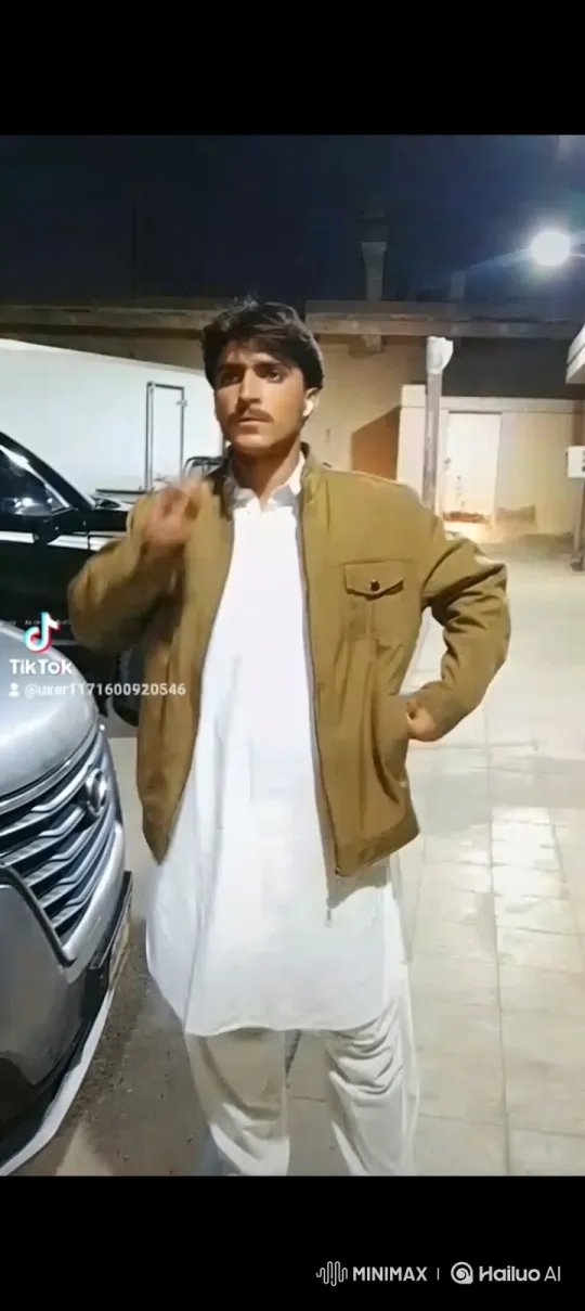Young Man in White Pose with Confident Smile – AI Generated Video | Hailuo AI