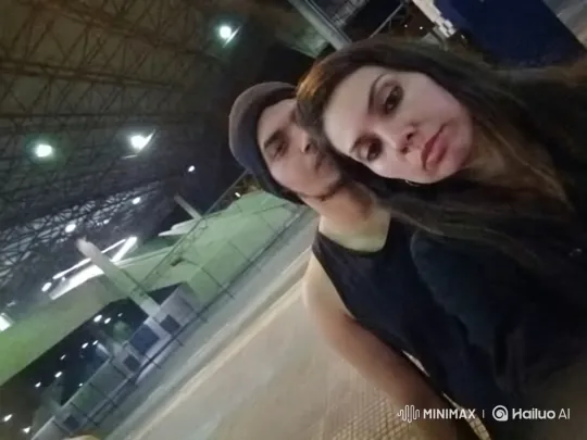 Young Couple Shares Intimate Moment in Dimly Lit Hall – AI Generated Video | Hailuo AI