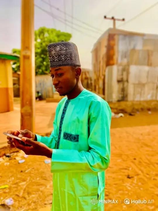 Young Man Enjoying Content on His Smartphone – AI Generated Video | Hailuo AI