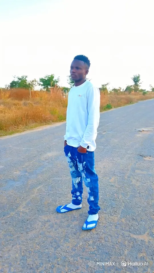 Young Man Poses with Sports Car on Mountain Road – AI Generated Video | Hailuo AI
