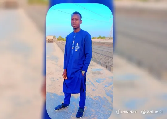 Young Man Poses with Moving Truck in Open Landscape – AI Generated Video | Hailuo AI