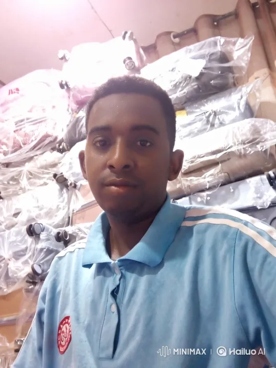 Young Man in Warehouse with Tracking Camera Shot – AI Generated Video | Hailuo AI