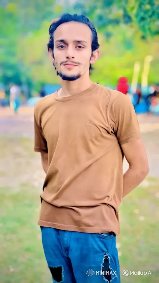 Young Man on Sidewalk Amidst Park's Serenity – AI Generated Video | Hailuo AI