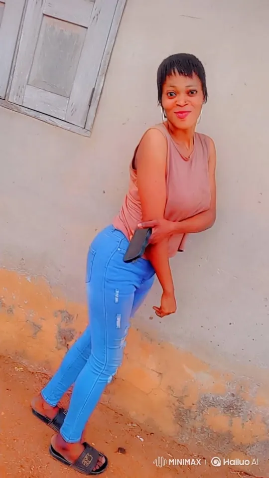 Woman Poses Casually with Smile, Capturing a Moment – AI Generated Video | Hailuo AI