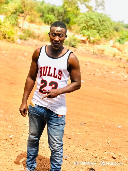 Man in Bulls Jersey Walks Confidently on Dirt Path – AI Generated Video | Hailuo AI