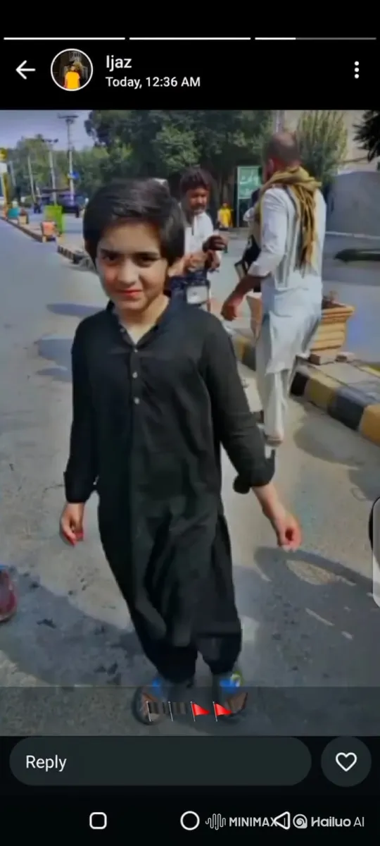 Young Boy in Black Tunic Walks on Street – AI Generated Video | Hailuo AI