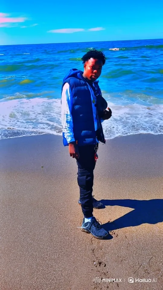 Young Man Contemplates at the Seaside – AI Generated Video | Hailuo AI