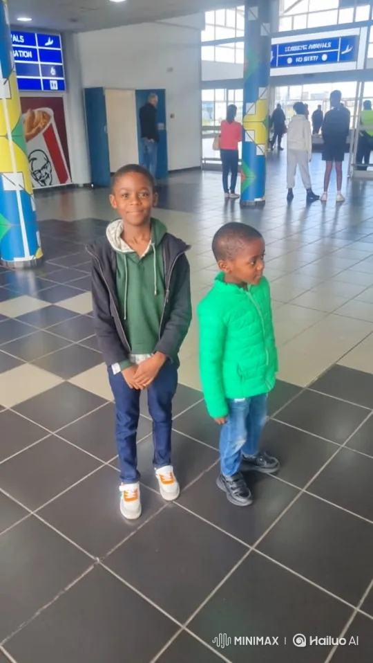 Two Boys Enter BMW at Airport Terminal – AI Generated Video | Hailuo AI