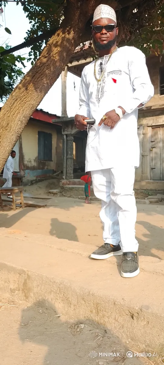 Man in White Clothing Examines Device Under Tree – AI Generated Video | Hailuo AI