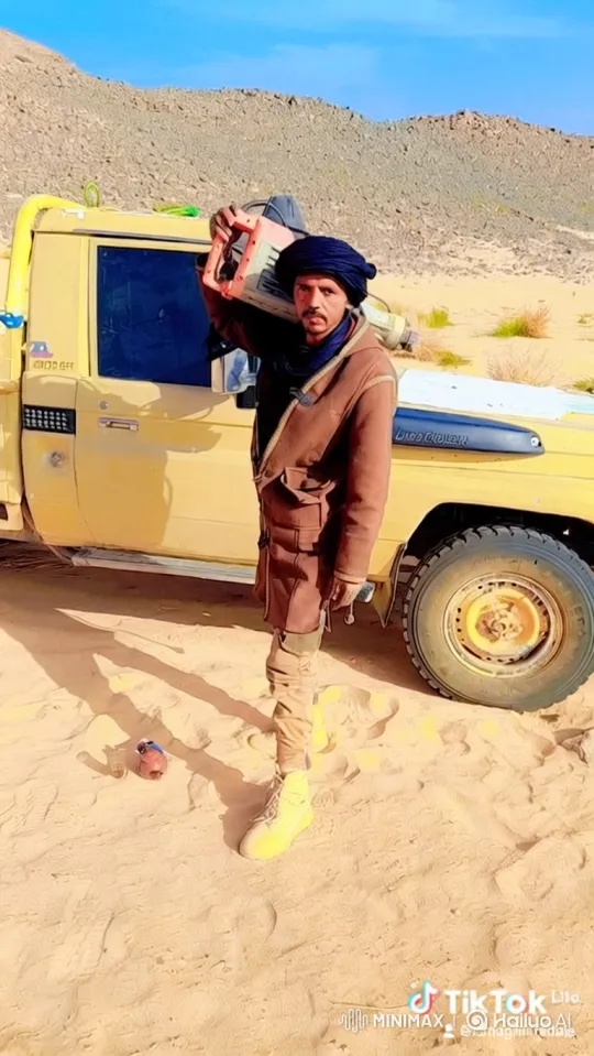 Man Prepares Tool, Drives Away in Desert Landscape – AI Generated Video | Hailuo AI
