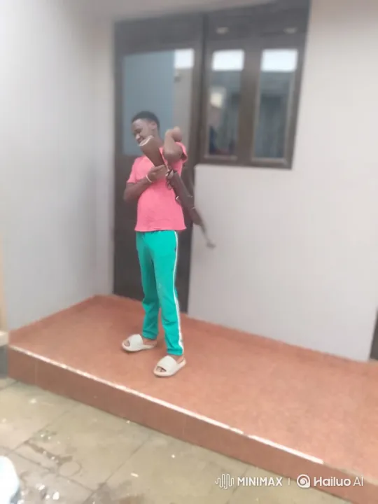 Young Man Examines and Operates Rifle on Porch – AI Generated Video | Hailuo AI