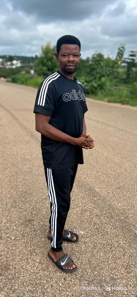 Man in Black Tracksuit Stands Calmly on Road – AI Generated Video | Hailuo AI