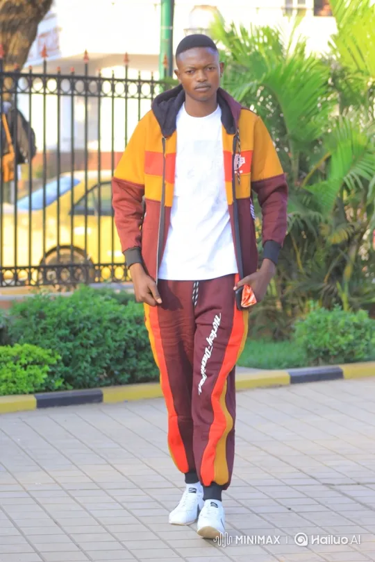 Young Black Man in Color-Blocked Tracksuit Walks Toward Camera – AI Generated Video | Hailuo AI