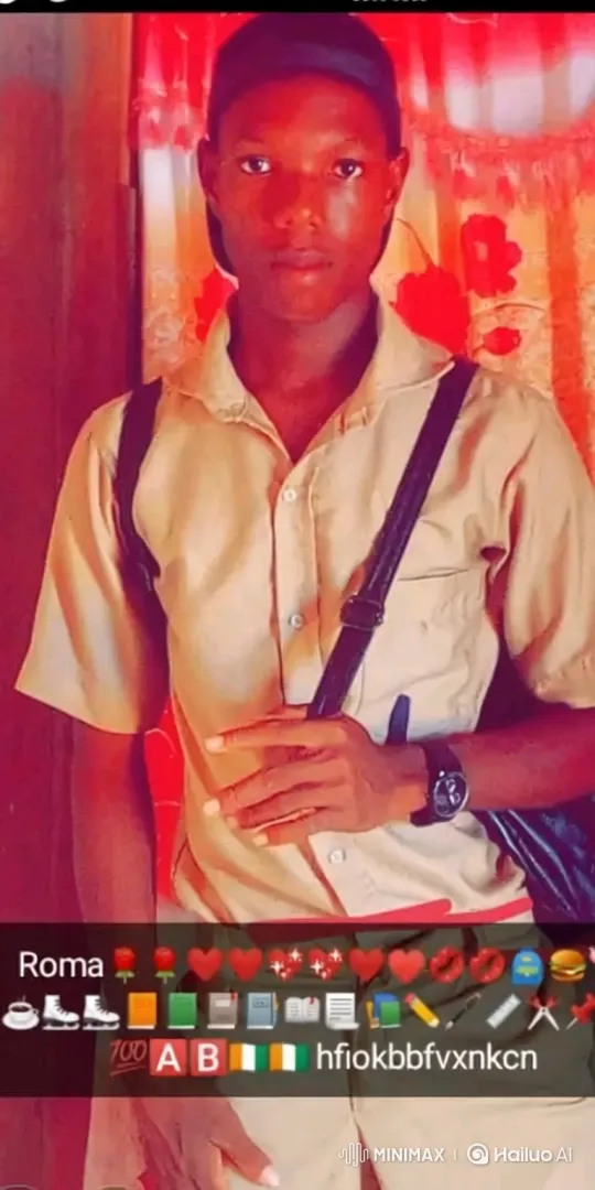 Young Man in Tan Shirt Holds Steady Gaze, Softly Smiles – AI Generated Video | Hailuo AI