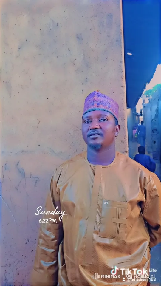 Man in Golden-Brown Tunic Stands Still During Tracking Shot – AI Generated Video | Hailuo AI