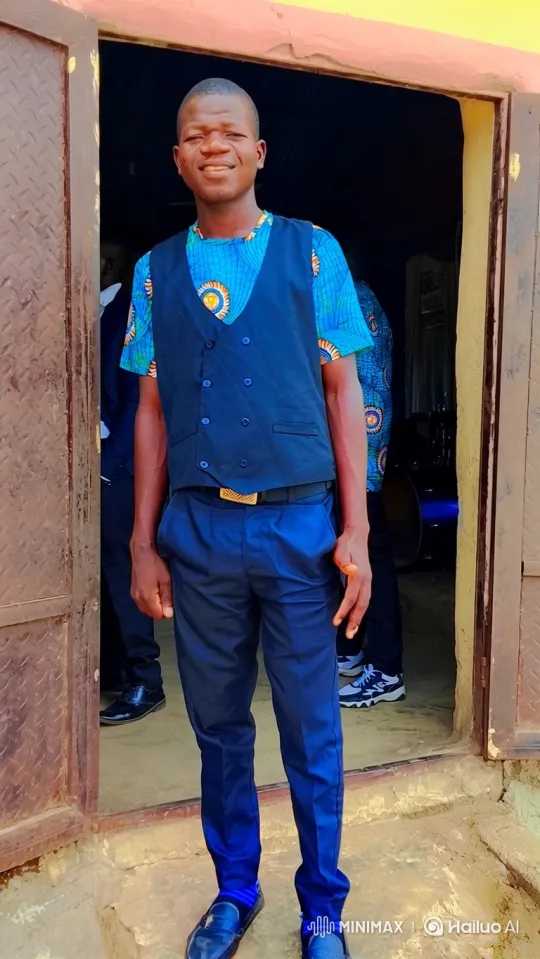 Young Man in Rustic Doorway with Confident Smile – AI Generated Video | Hailuo AI