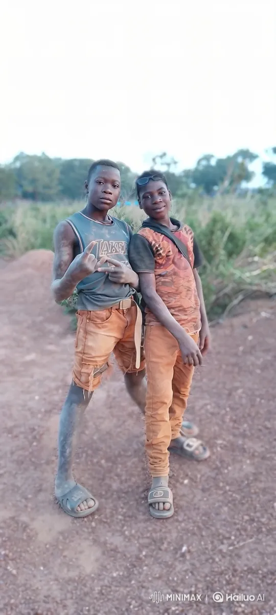 Two Boys Pose with Subtle Gestures in Dusty Setting – AI Generated Video | Hailuo AI