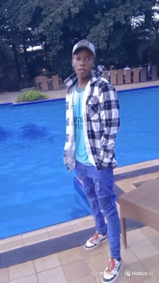 Young Man by Pool: Casual Pose and Confident Smile – AI Generated Video | Hailuo AI