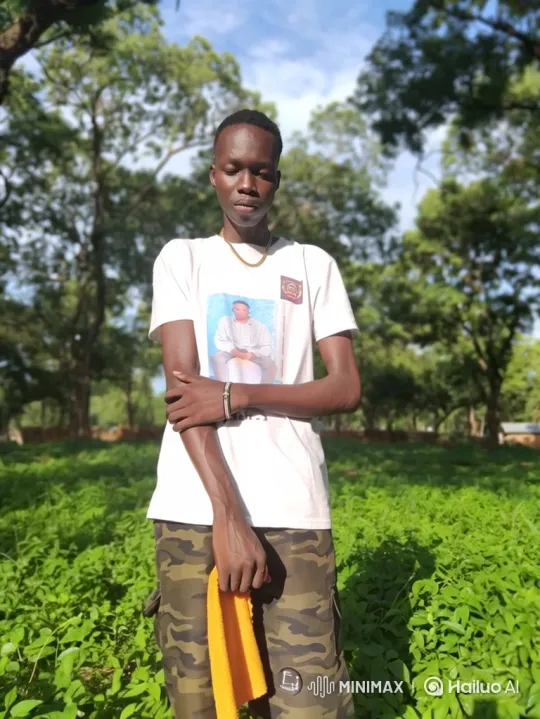 Young Man Contemplates in a Sunlit Clearing – AI Generated Video | Hailuo AI