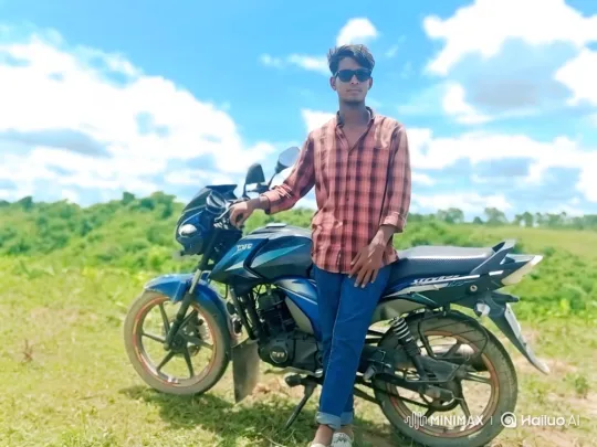 Young Man Poses with Motorcycle in Sunny Field – AI Generated Video | Hailuo AI