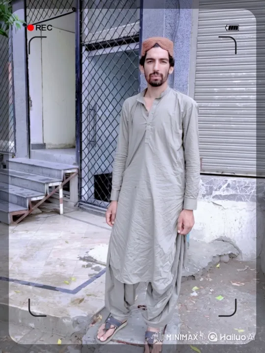 Man in Grey Stand Calmly Outside Building – AI Generated Video | Hailuo AI