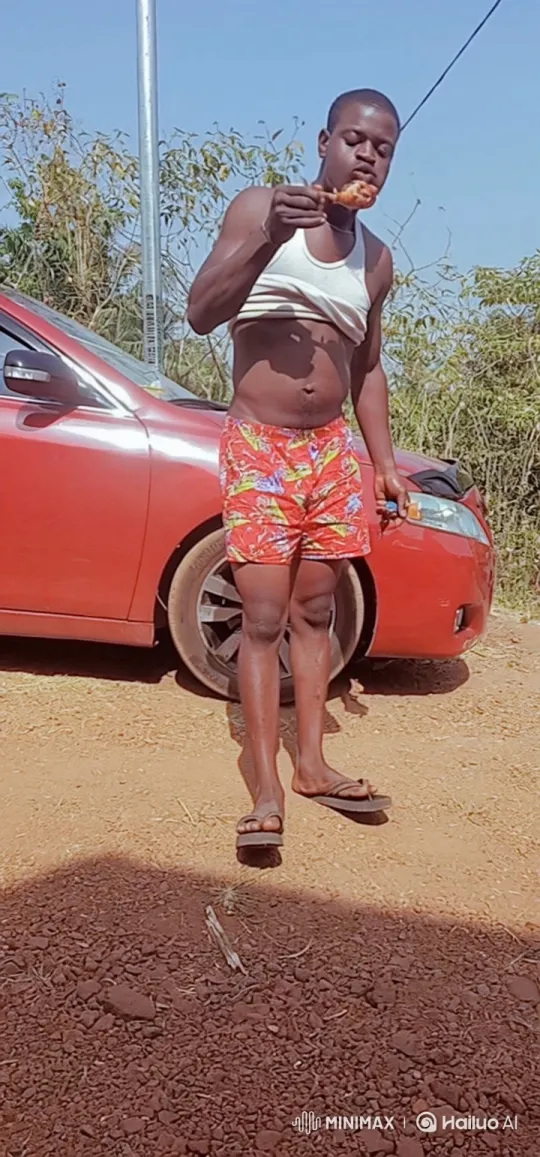 Young Man Enjoying Fried Chicken Outdoors – AI Generated Video | Hailuo AI