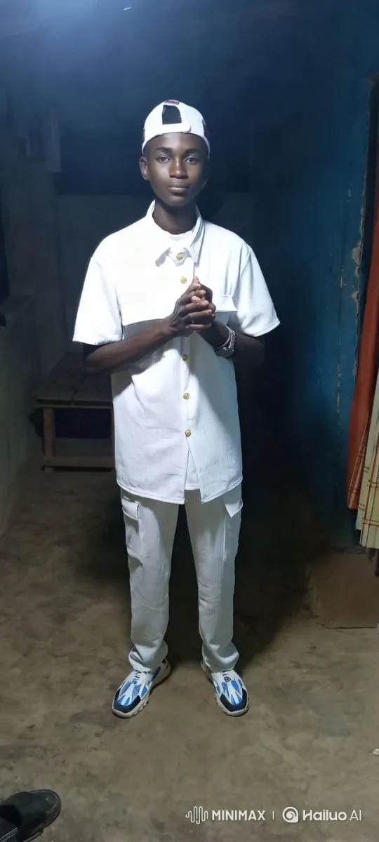Young Man in All-White Stands Confidently in Dim Room – AI Generated Video | Hailuo AI