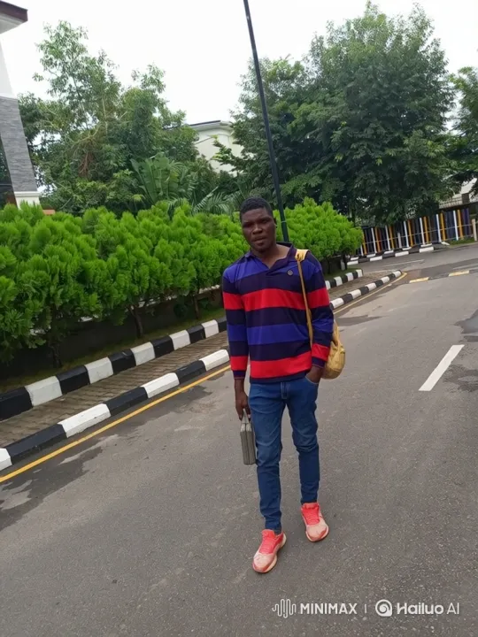 Man in Striped Shirt Walks Along Paved Road – AI Generated Video | Hailuo AI