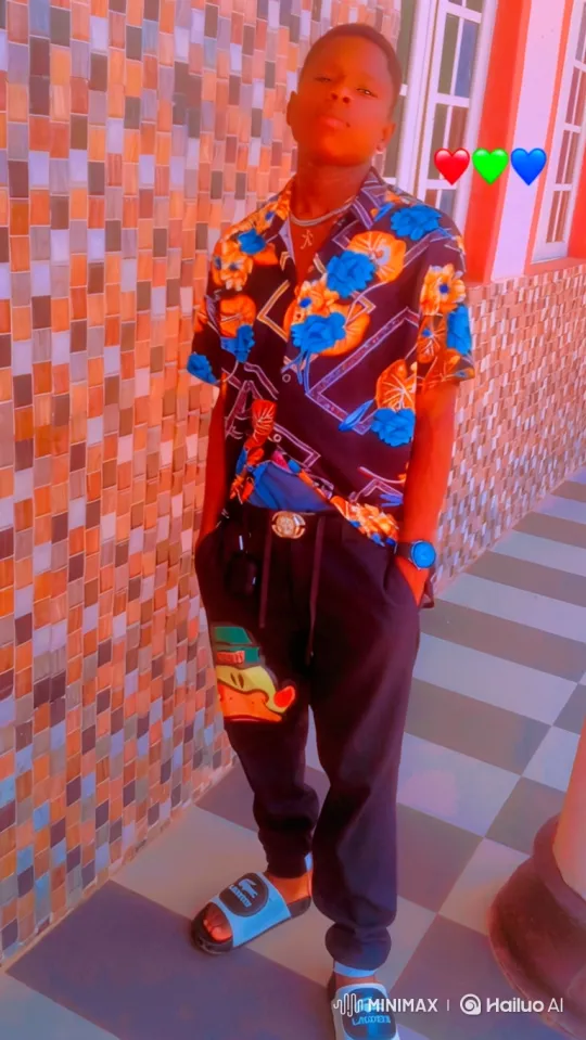 Young Man Poses Confidently in Front of Decorative Wall – AI Generated Video | Hailuo AI