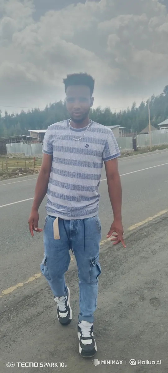 Contemplative Young Man Walking on Empty Road – AI Generated Video | Hailuo AI