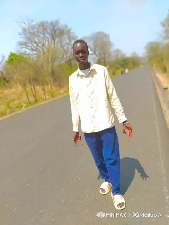 Young Man Walking Down Rural Road – AI Generated Video | Hailuo AI