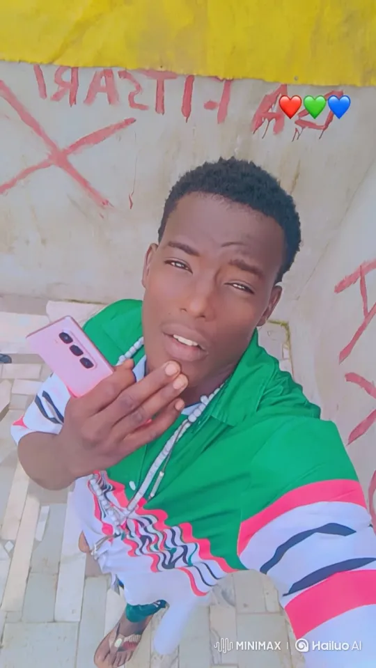 Young Man Takes Selfie with Pink Smartphone – AI Generated Video | Hailuo AI