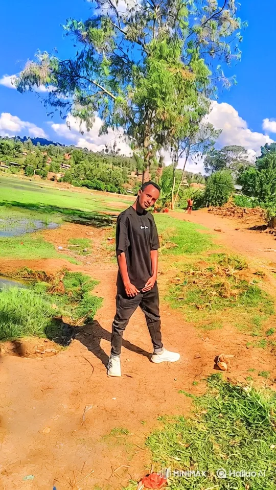 Young Man in Serene Rural Landscape – AI Generated Video | Hailuo AI