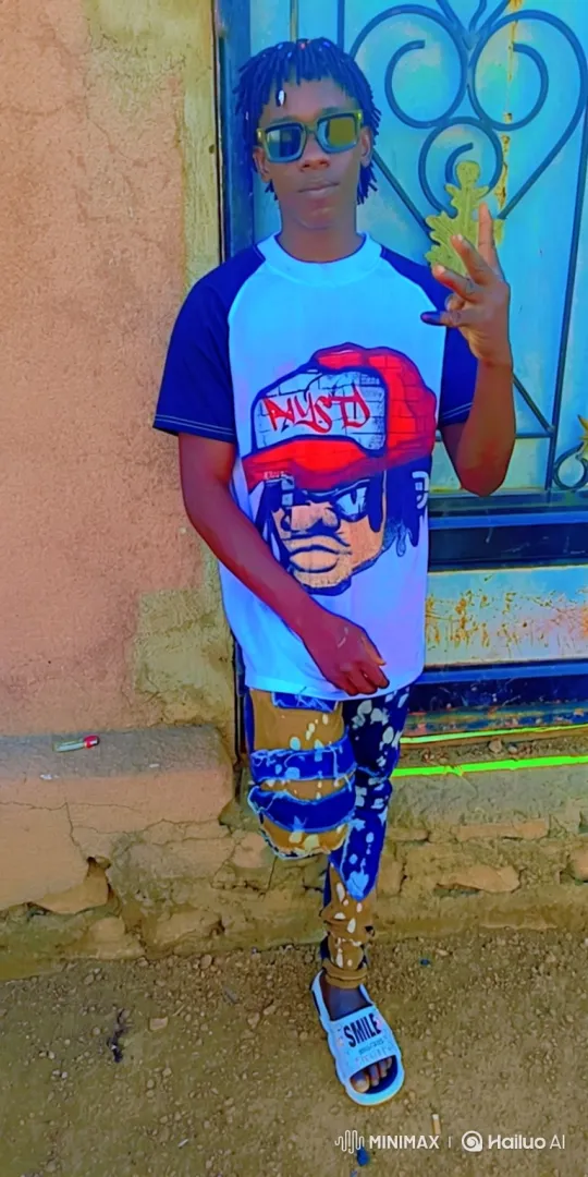 Young Man Poses Stylishly Against Wall – AI Generated Video | Hailuo AI
