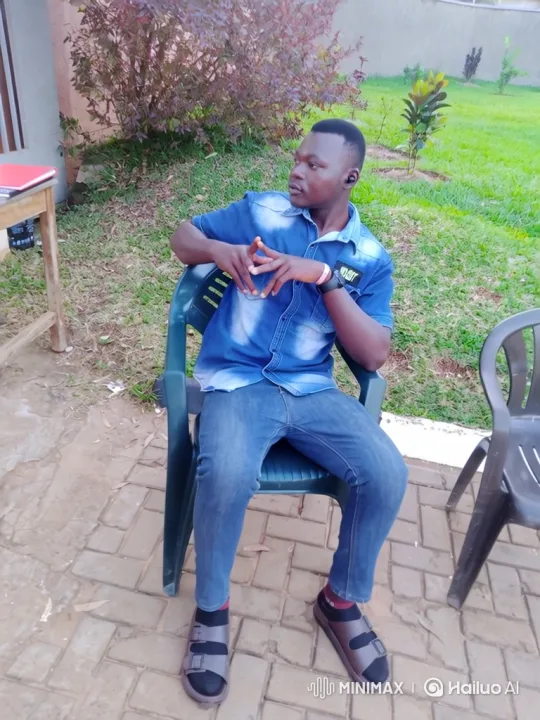 Young Man Reflects in Quiet Patio Setting – AI Generated Video | Hailuo AI