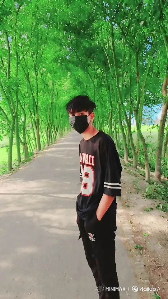 Young Man Strolls Down Scenic Tree-Lined Path – AI Generated Video | Hailuo AI