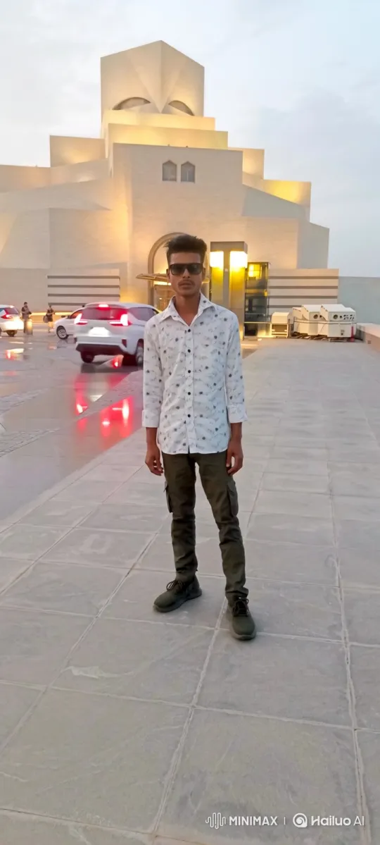 Young Man in Plaza with Modern Building Background – AI Generated Video | Hailuo AI