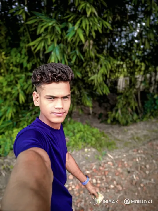Young Man in Bamboo Grove with Gentle Smile – AI Generated Video | Hailuo AI
