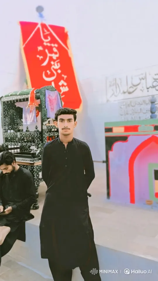 Observational Portrait of a Young Man in a Red-Bannered Room – AI Generated Video | Hailuo AI
