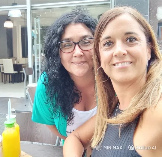 Outdoor Cafe: Two Women Share a Passionate Kiss – AI Generated Video | Hailuo AI
