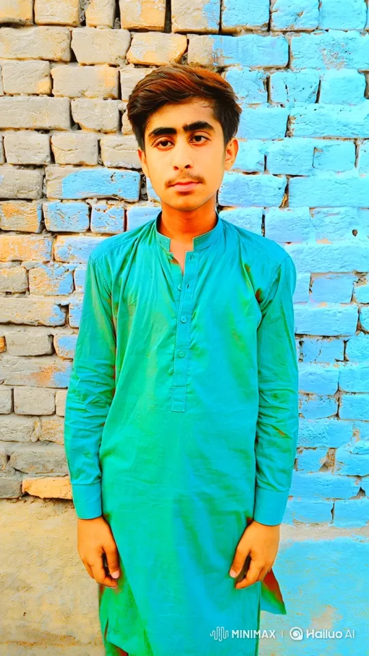 Young Man in Green Tunic Stares Calmly at Camera – AI Generated Video | Hailuo AI
