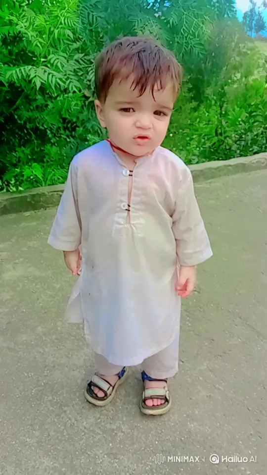 Toddler Takes First Steps in Green Background – AI Generated Video | Hailuo AI