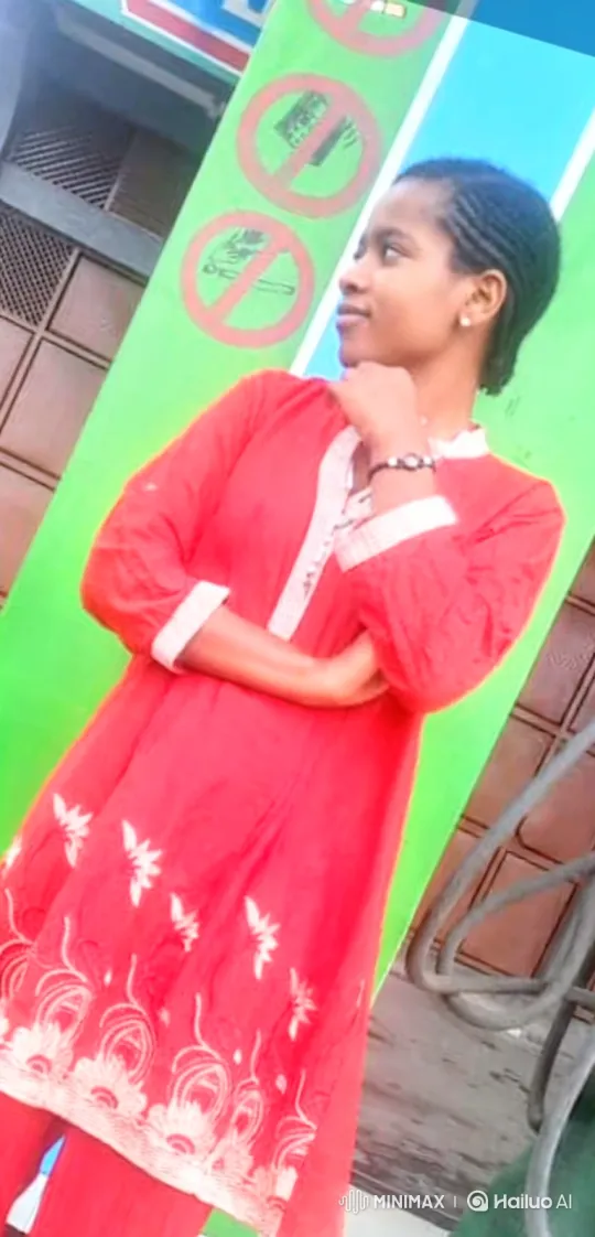 Young Woman in Red Tunic Ponders Calmly – AI Generated Video | Hailuo AI