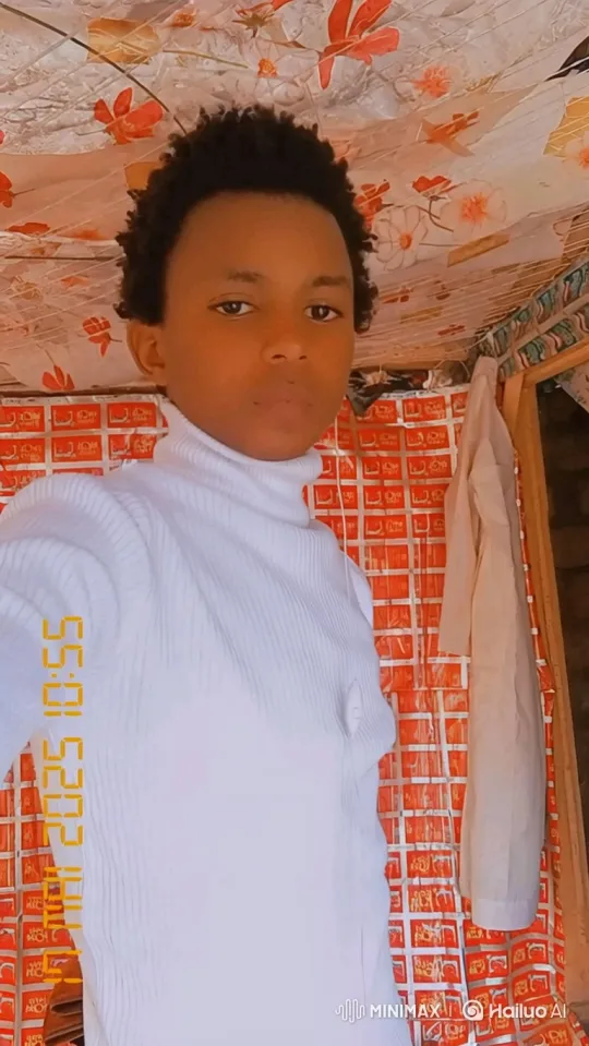 Young Person in White Turtleneck Amidst Patterned Room – AI Generated Video | Hailuo AI