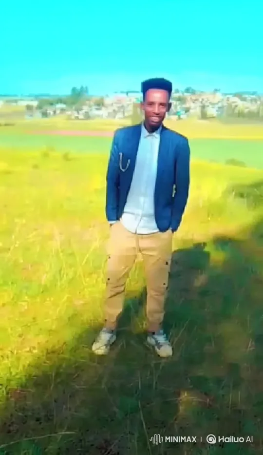 Young Man in Field: Warm Smile and Confident Walk – AI Generated Video | Hailuo AI