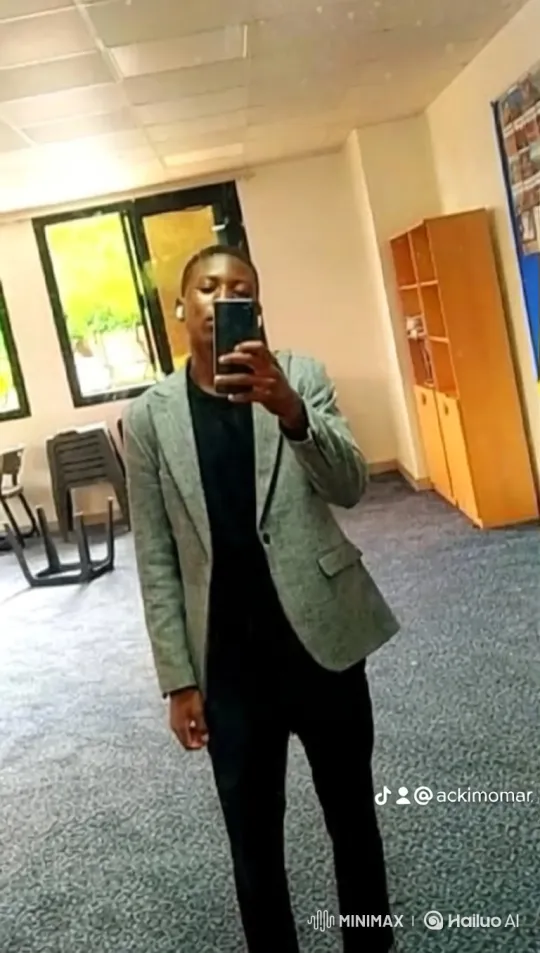 Young Man Taking Mirror Selfie in a Room – AI Generated Video | Hailuo AI