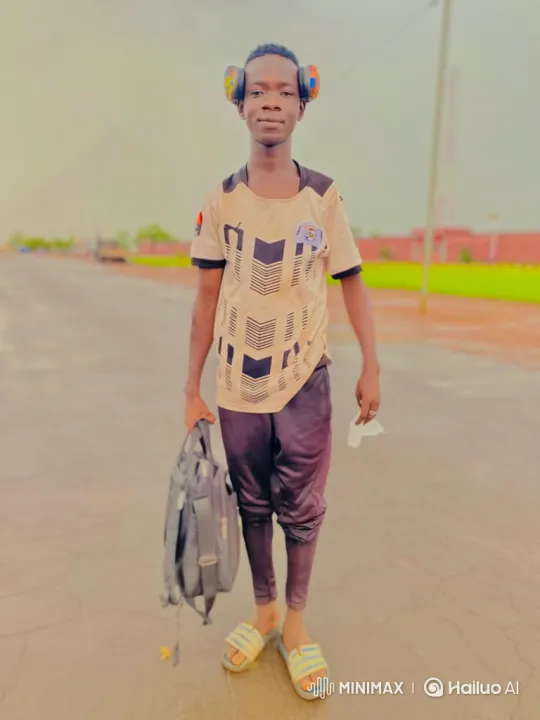 Young Man Walking Down Wet Road with Bag – AI Generated Video | Hailuo AI