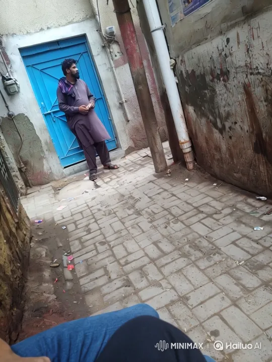 Man in Purple Attire Observes from Alley – AI Generated Video | Hailuo AI