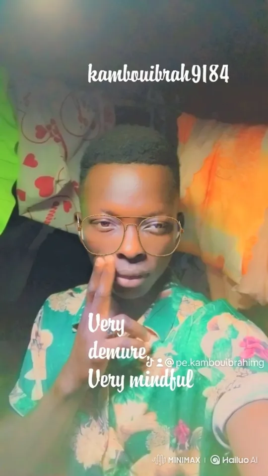 Young Man in Pensive Pose Amidst Heart Pillows – AI Generated Video | Hailuo AI