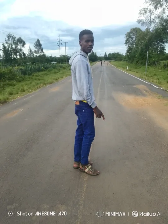 Young Man Walks Down Country Road – AI Generated Video | Hailuo AI